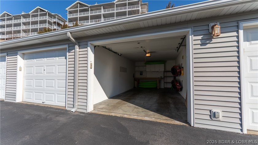 Huge screened deck, 12x32 boat slip with 8,000 lb lift, and rare - photo 30