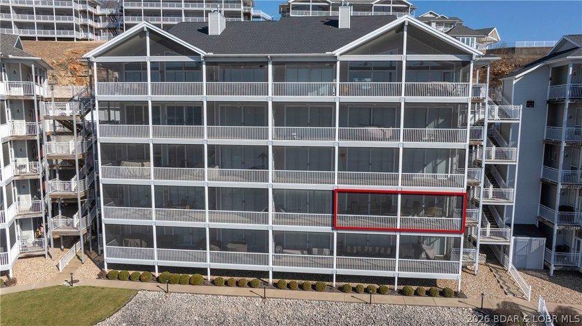 Huge screened deck, 12x32 boat slip with 8,000 lb lift, and rare - photo 35