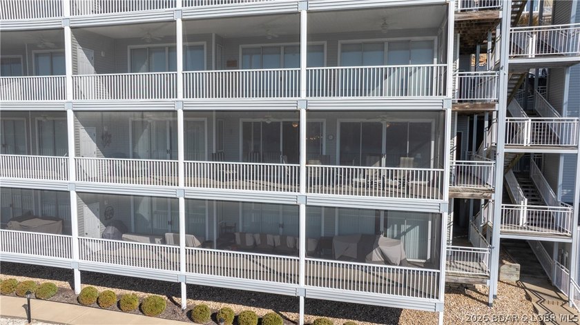 Huge screened deck, 12x32 boat slip with 8,000 lb lift, and rare - photo 38