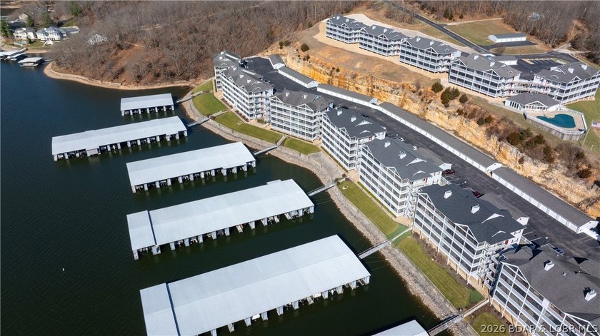 Huge screened deck, 12x32 boat slip with 8,000 lb lift, and rare - photo 42