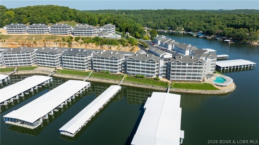 Huge screened deck, 12x32 boat slip with 8,000 lb lift, and rare - photo 50