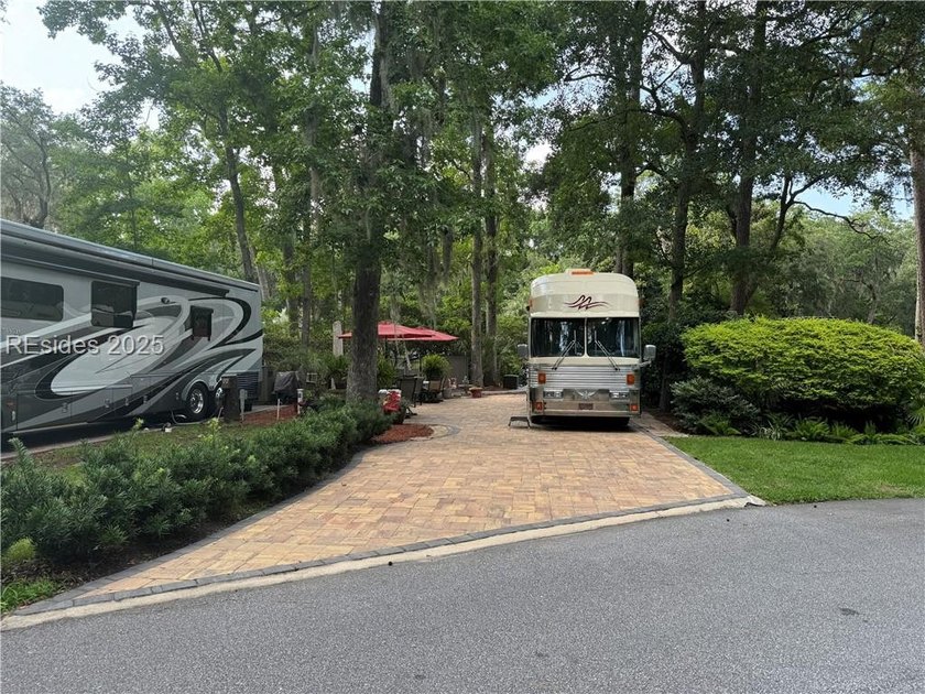 This gorgeous RV lot has a paver pad with a hardscape wall and - photo 2
