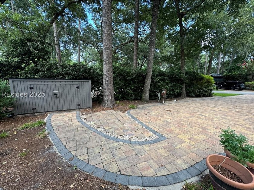 This gorgeous RV lot has a paver pad with a hardscape wall and - photo 3