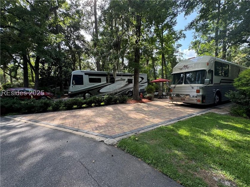 This gorgeous RV lot has a paver pad with a hardscape wall and - photo 5