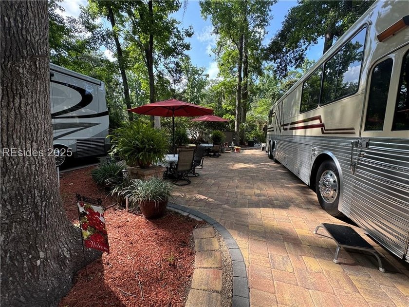 This gorgeous RV lot has a paver pad with a hardscape wall and - photo 6