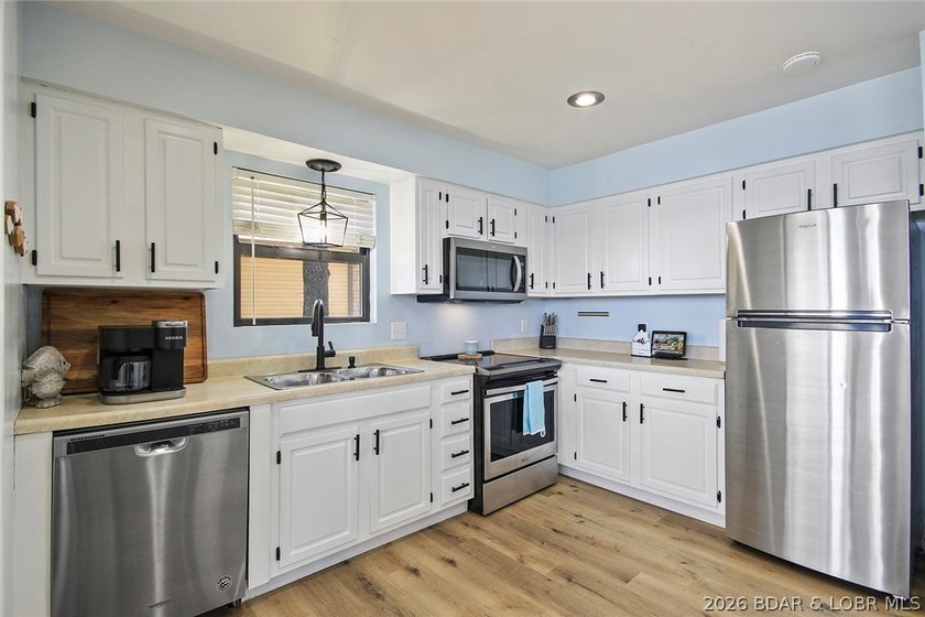 Enjoy unbeatable lake views from this beautifully updated - photo 16