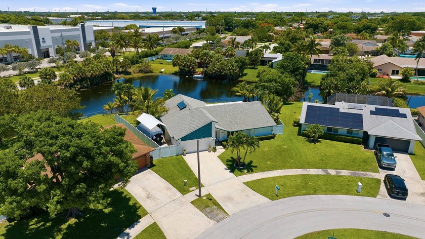This well-maintained 3-bed, 2-bath CBS pool home sits on one of - photo 4