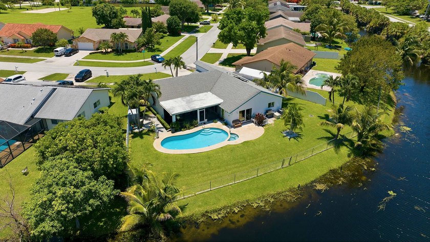 This well-maintained 3-bed, 2-bath CBS pool home sits on one of - photo 6
