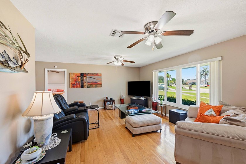 This well-maintained 3-bed, 2-bath CBS pool home sits on one of - photo 7
