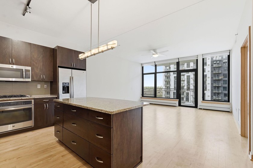 Modern Mill District Condo with a spacious floorplan flooded - photo 9