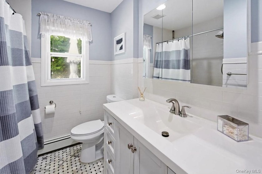 Refined comfort meets effortless Long Island living in this - photo 12