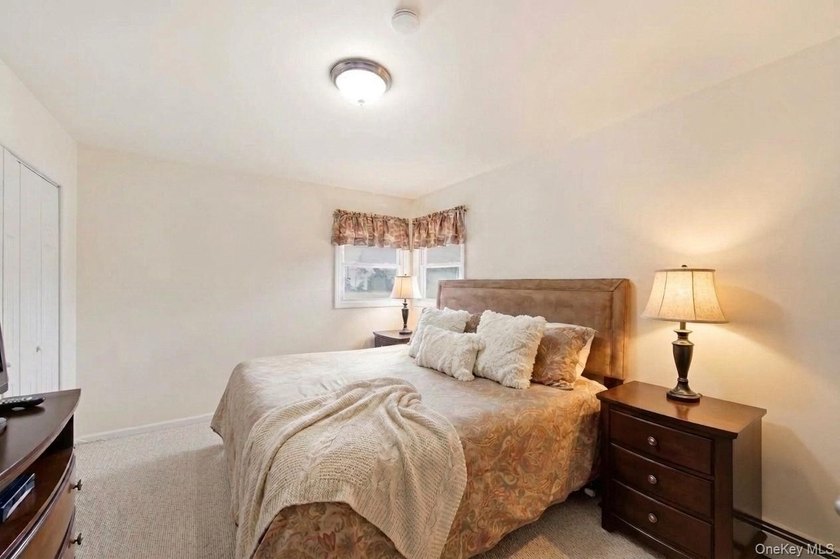 Refined comfort meets effortless Long Island living in this - photo 13