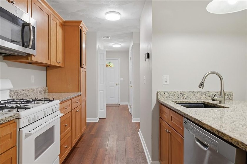 Welcome to this well-maintained 2-bedroom, 1.5-bath condominium - photo 11