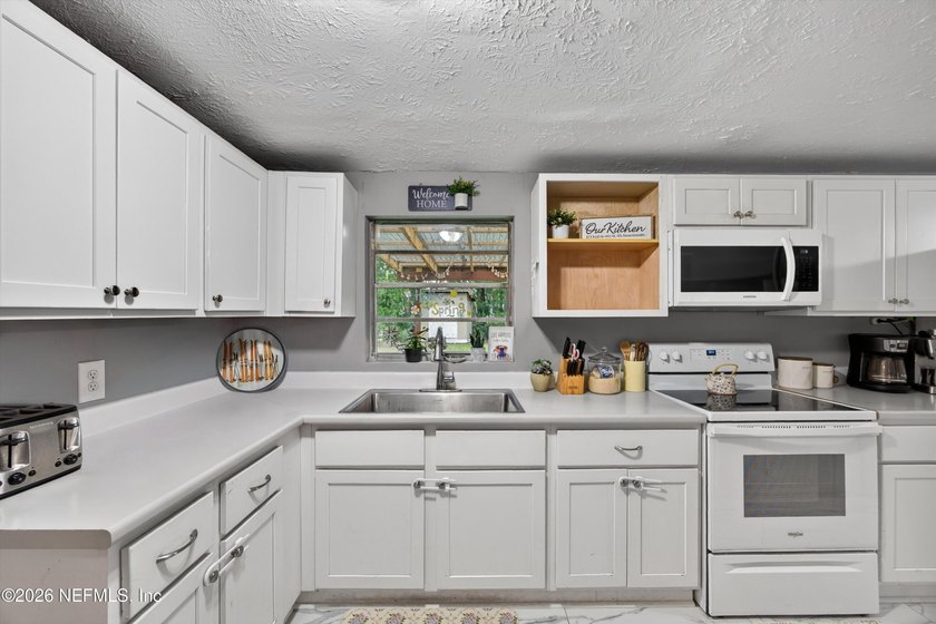 Welcome to this Charming 4-bedroom, 2-full bath home in the - photo 7