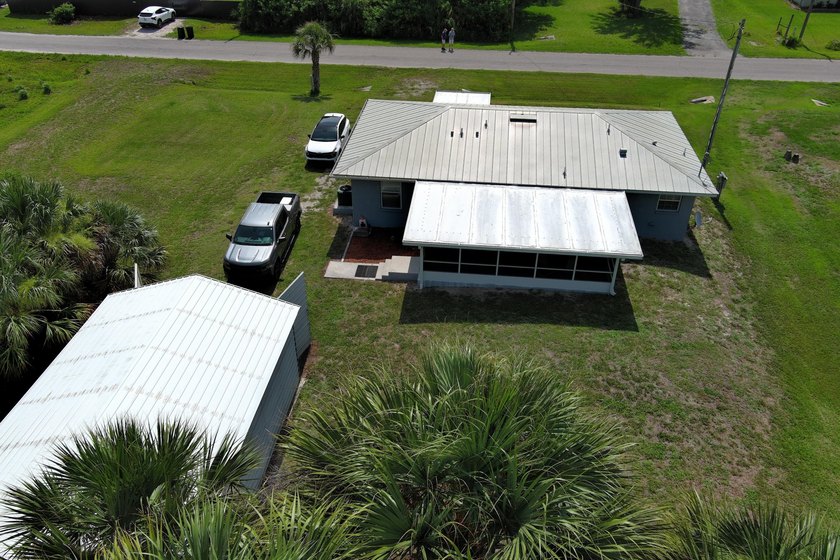 This marvelous custom-built CBS pristine, furnished home on .27 - photo 4
