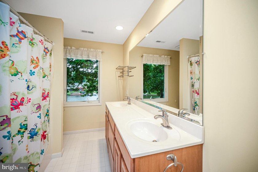 Nestled in a peaceful cove with stunning main lake views and - photo 30