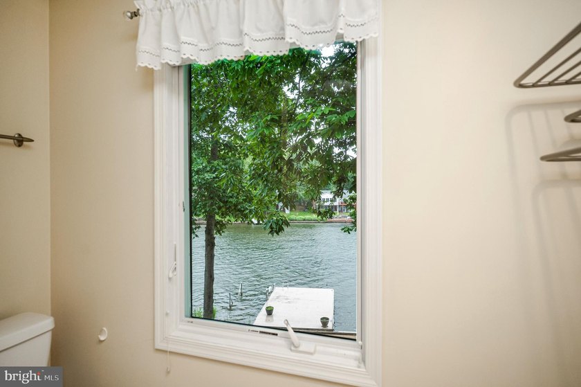 Nestled in a peaceful cove with stunning main lake views and - photo 31