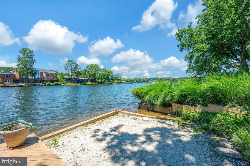 Nestled in a peaceful cove with stunning main lake views and - photo 46