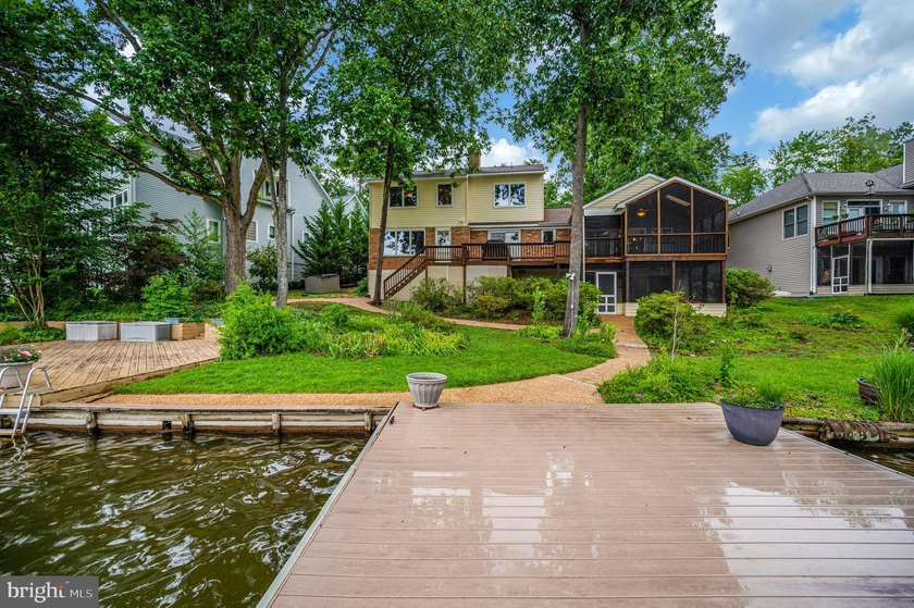 Nestled in a peaceful cove with stunning main lake views and - photo 48
