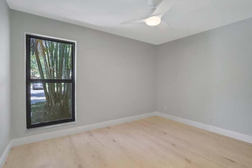 Make this beautifully remodeled 2-bedroom, 2-bath villa in - photo 17