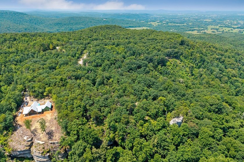 Escape to 5.66 private acres in Sparta, TN! Includes a level pad - photo 5