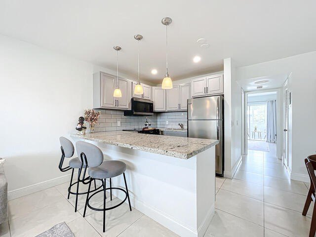 Tenant occupied serene lakefront unit in a 55+ gated community - photo 4
