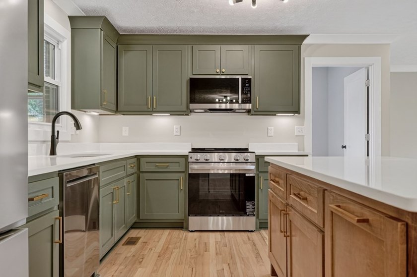 Completely remodeled and move-in ready! This beautiful brick - photo 8