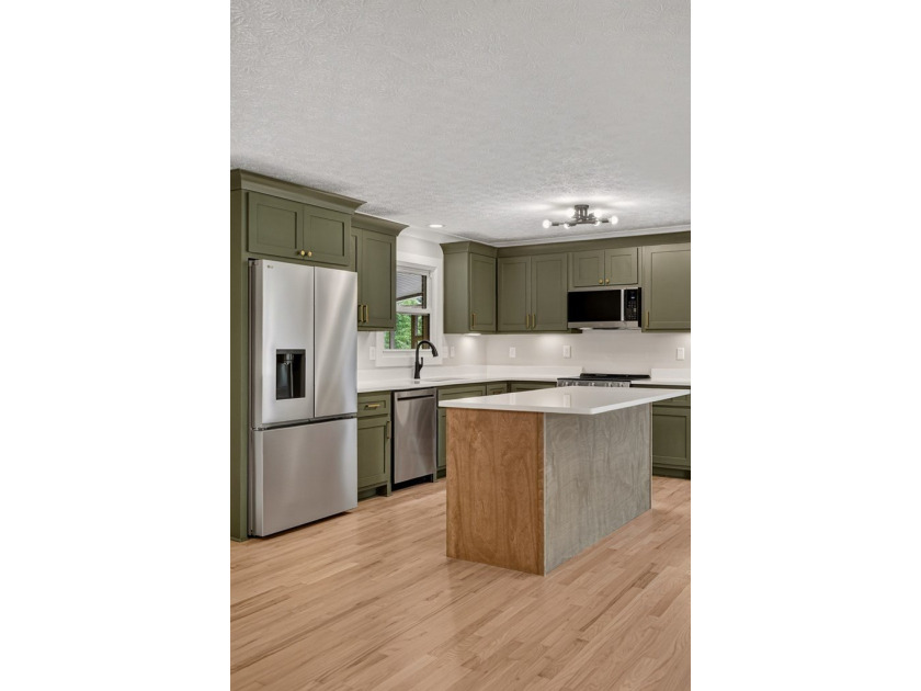 Completely remodeled and move-in ready! This beautiful brick - photo 9