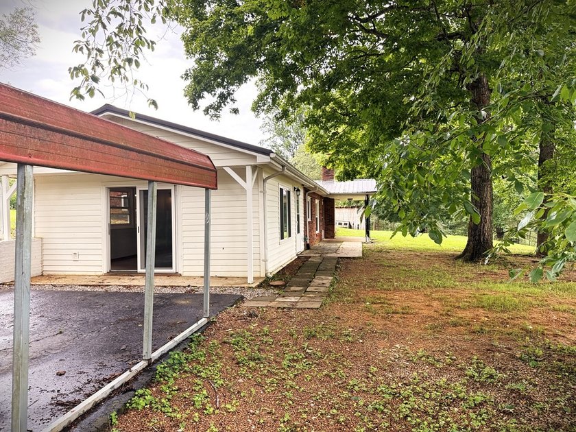 Tucked away on 5 fully fenced acres, this unique 3-bed, 2-bath - photo 4