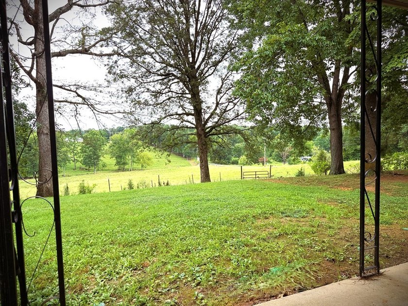 Tucked away on 5 fully fenced acres, this unique 3-bed, 2-bath - photo 8