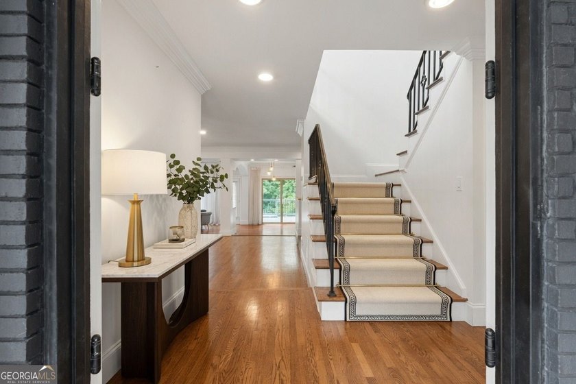 Nestled on a private wooded lot in the highly sought-after - photo 12