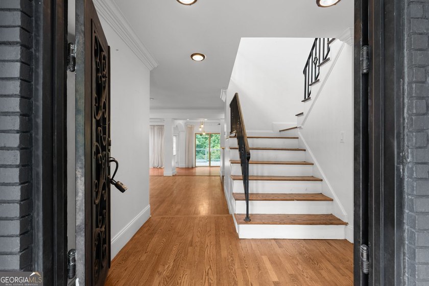 Nestled on a private wooded lot in the highly sought-after - photo 13
