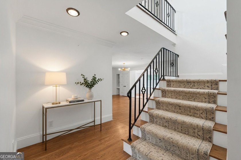 Nestled on a private wooded lot in the highly sought-after - photo 15