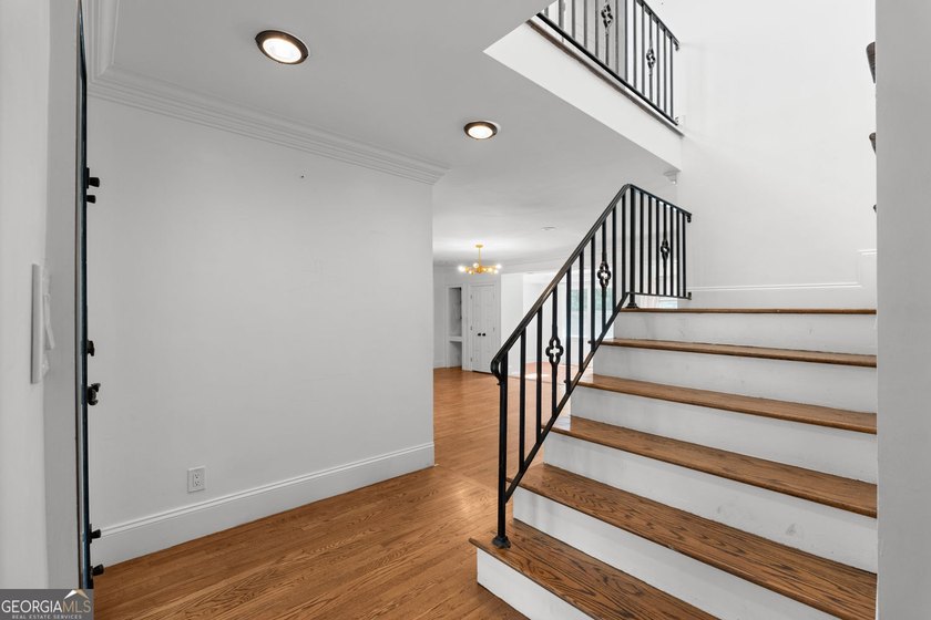 Nestled on a private wooded lot in the highly sought-after - photo 16