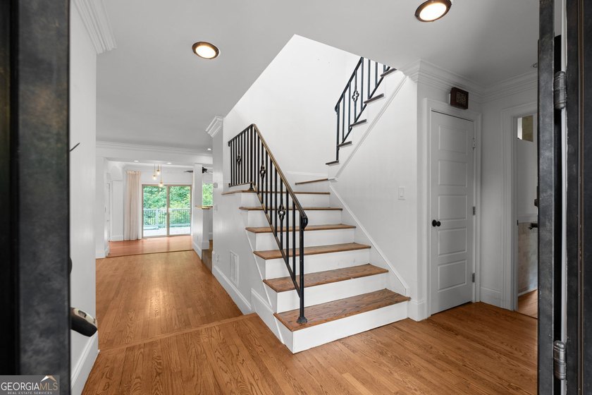 Nestled on a private wooded lot in the highly sought-after - photo 17