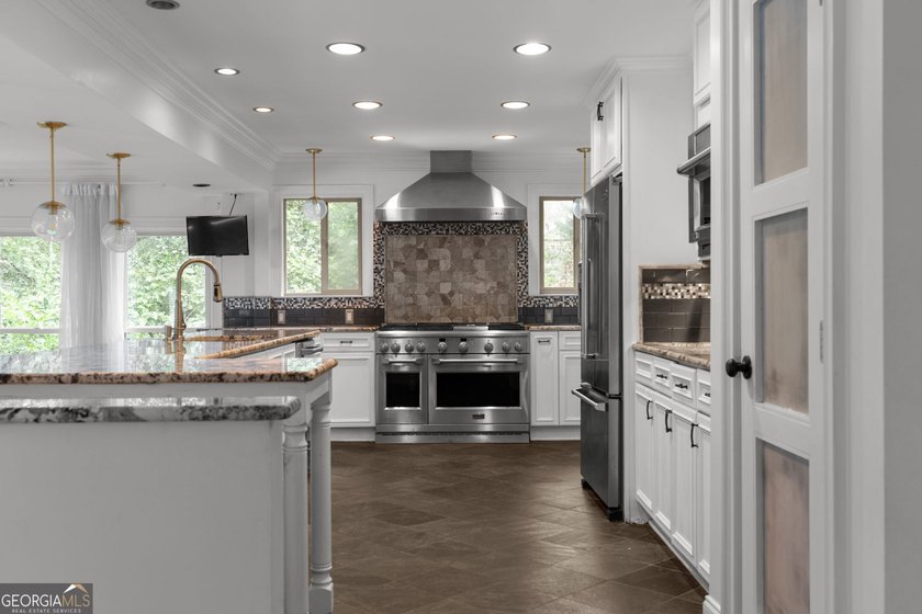 Nestled on a private wooded lot in the highly sought-after - photo 20