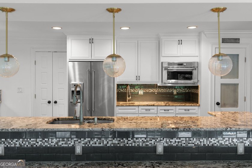 Nestled on a private wooded lot in the highly sought-after - photo 24