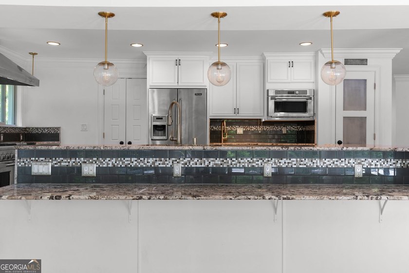 Nestled on a private wooded lot in the highly sought-after - photo 25