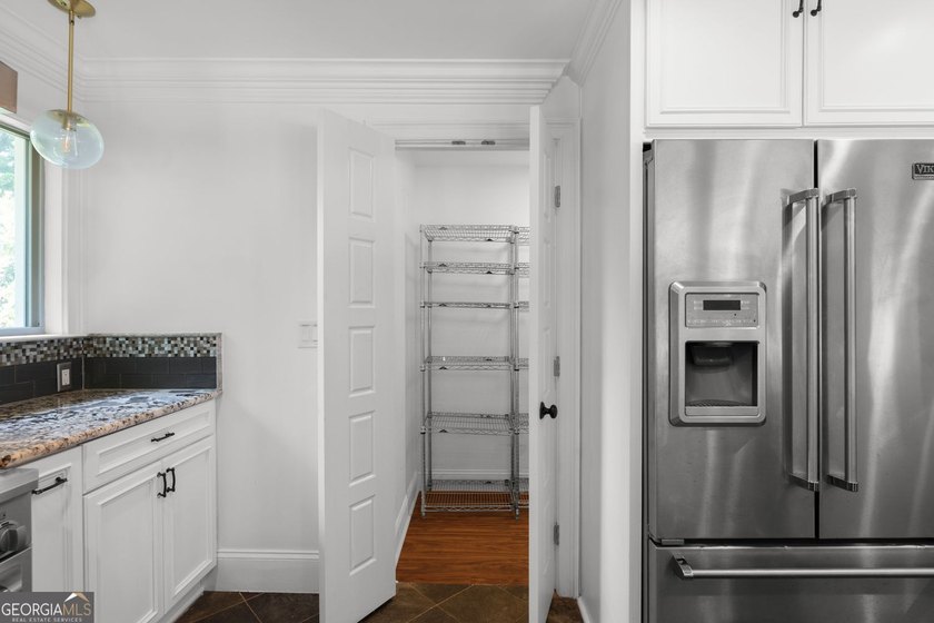 Nestled on a private wooded lot in the highly sought-after - photo 26