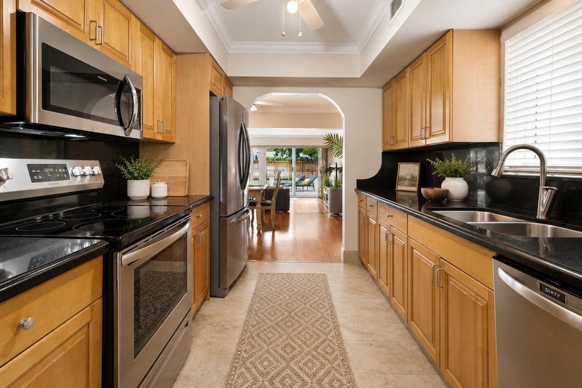 Discover this beautifully maintained 3-bedroom, 2-bath pool home - photo 9