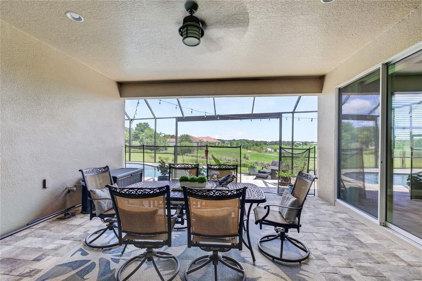 Virtually Staged. Enjoy golf and water views from this - photo 35