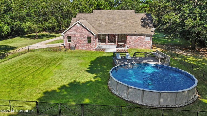 PRICE REDUCED! Situated on 7 acres with a pond and a 30' - photo 4