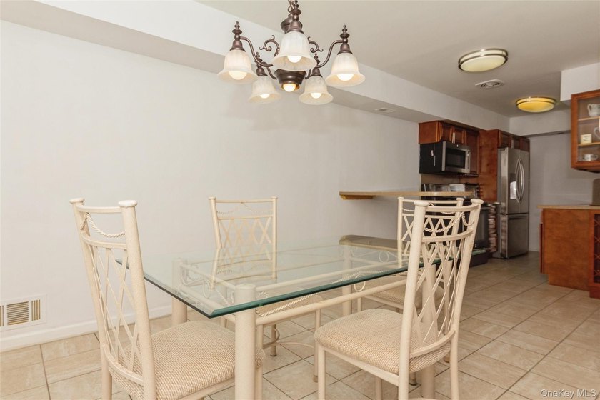 Welcome to 51 Alhambra Dr. Enjoy the open dining area off the - photo 12