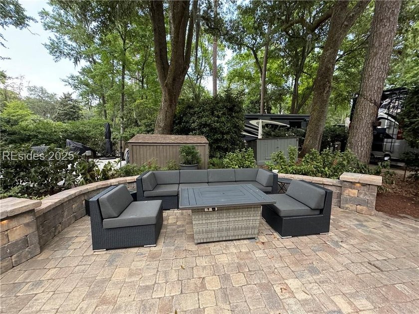 This gorgeous RV lot has a paver pad and a hardscape wall with - photo 2