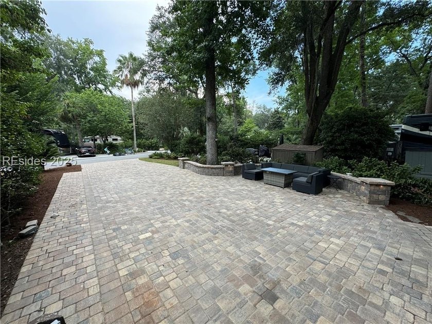 This gorgeous RV lot has a paver pad and a hardscape wall with - photo 4