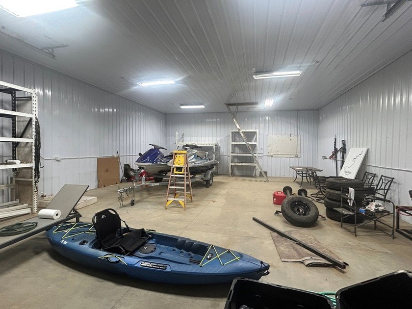 Enjoy nearly an acre of level waterfront property where the - photo 12