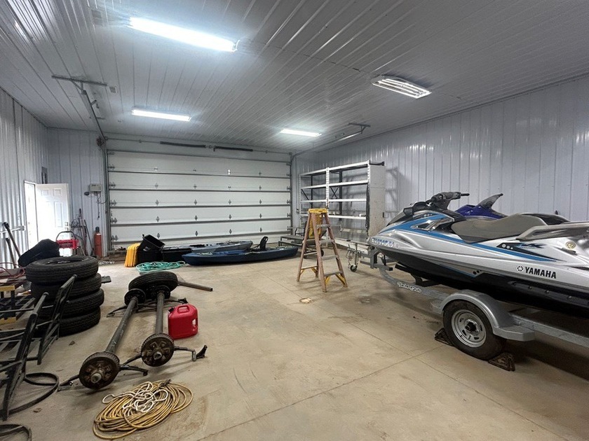 Enjoy nearly an acre of level waterfront property where the - photo 13