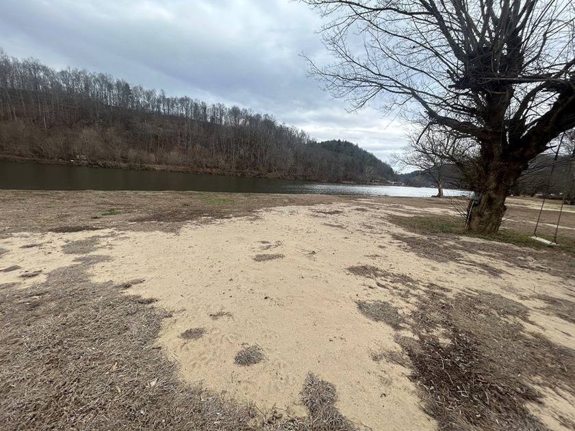 Enjoy nearly an acre of level waterfront property where the - photo 18