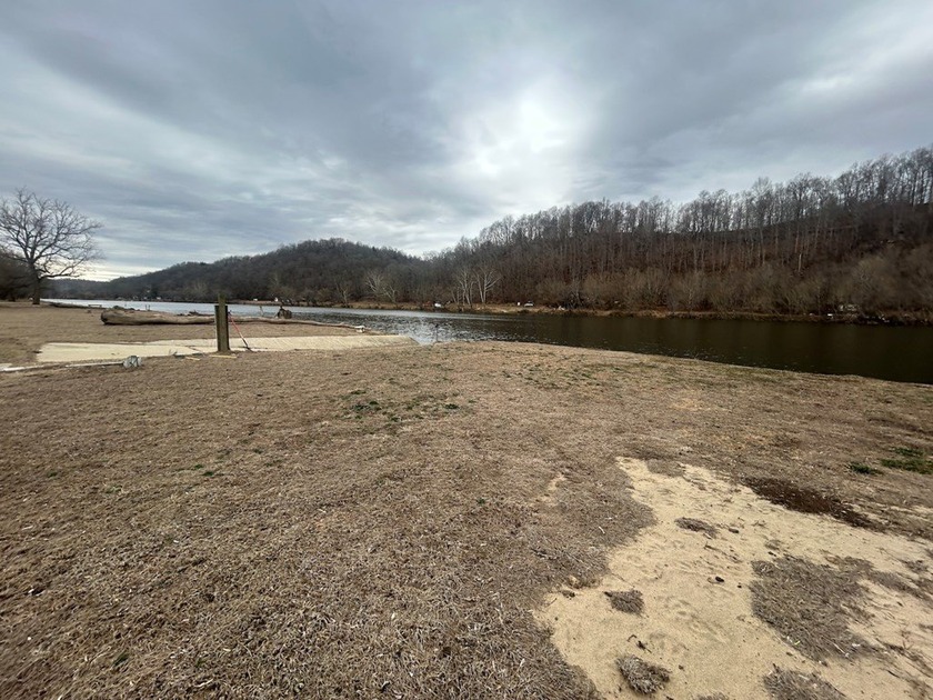 Enjoy nearly an acre of level waterfront property where the - photo 19