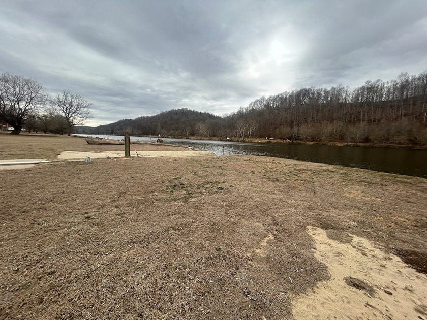 Enjoy nearly an acre of level waterfront property where the - photo 20